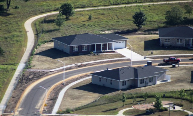 Workers with contractor Relyant Global LLC of Maryville, Tenn., continue work on a U.S. Army Corps of Engineers-led project Aug. 4, 2020, to build seven new military family housing units at the South Post Housing area in this aerial view at Fort...