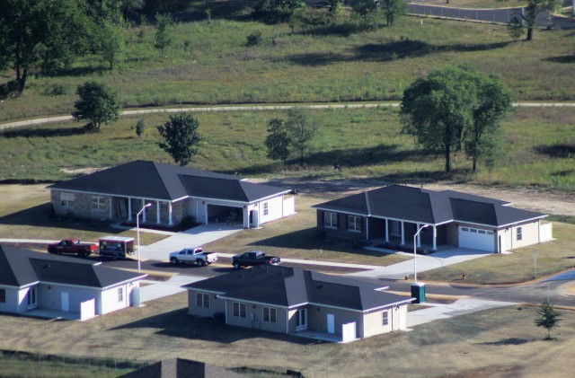 Workers with contractor Relyant Global LLC of Maryville, Tenn., continue work on a U.S. Army Corps of Engineers-led project Aug. 4, 2020, to build seven new military family housing units at the South Post Housing area in this aerial view at Fort...