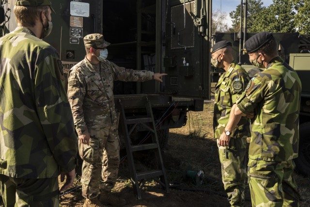 Swedish soldiers, assigned to the Air Defence Regiment, visit U.S. Soldiers assigned to the 5th Battalion, 7th Air Defense Artillery Regiment, 10th Army Air and Missile Defense Command, in Baumholder training Area, Germany on Aug. 18-20. The Swedish Armed Forces visit was to observe  training and to collaborate with the U.S. air defense artillery unit, and to discuss future training that may take place in the European theater.