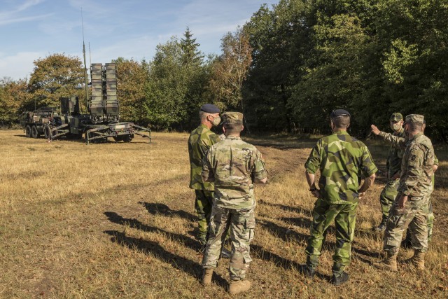 Swedish soldiers, assigned to the Air Defence Regiment, visit U.S. Soldiers assigned to the 5th Battalion, 7th Air Defense Artillery Regiment, 10th Army Air and Missile Defense Command, in Baumholder training Area, Germany on Aug. 18-20. The Swedish Armed Forces visit was to observe  training and to collaborate with the U.S. air defense artillery unit, and to discuss future training that may take place in the European theater.