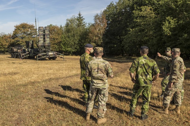 Swedish soldiers, assigned to the Air Defence Regiment, visit U.S. Soldiers assigned to the 5th Battalion, 7th Air Defense Artillery Regiment, 10th Army Air and Missile Defense Command, in Baumholder training Area, Germany on Aug. 18-20. The...