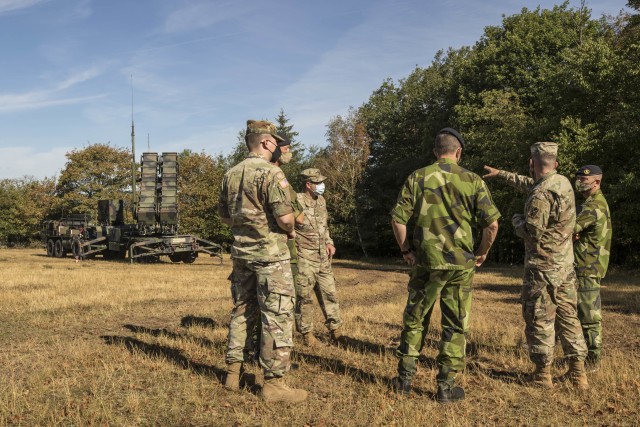 Swedish soldiers, assigned to the Air Defence Regiment, visit U.S. Soldiers assigned to the 5th Battalion, 7th Air Defense Artillery Regiment, 10th Army Air and Missile Defense Command, in Baumholder training Area, Germany on Aug. 18-20. The Swedish Armed Forces visit was to observe  training and to collaborate with the U.S. air defense artillery unit, and to discuss future training that may take place in the European theater.