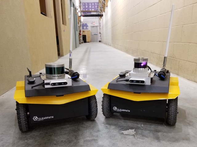 The two robots used in the experiments are identically equipped, with the exception of Velodyne VLP-16 LiDAR (left) and Ouster OS1 LiDAR (right). 