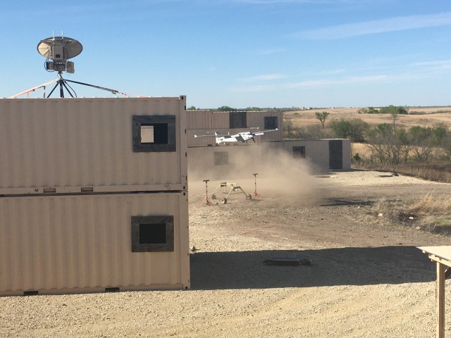 Soldiers from the 1st Armored Brigade Combat Team, 1st Infantry Division, execute the air vehicle control handoff capabilities with the Arcturus UAV's JUMP 20 in a simulated urban environment during the Army's FTUAS capability assessment, at Fort Riley, Kansas. The landing and subsequent takeoff showed the ability of the UAS to take off and land in a confined area without the need for a runway. (Program Executive Office, Aviation photo)