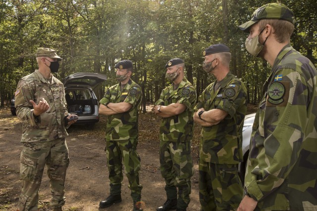 Swedish soldiers, assigned to the Air Defence Regiment, visit U.S. Soldiers assigned to the 5th Battalion, 7th Air Defense Artillery Regiment, 10th Army Air and Missile Defense Command, in Baumholder training Area, Germany on Aug. 18-20. The...