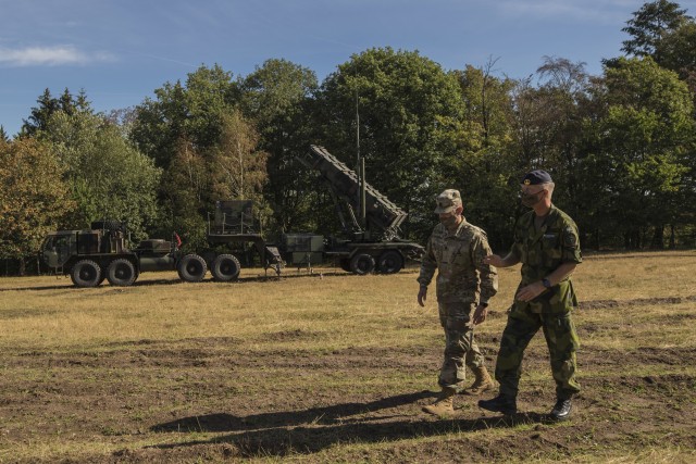 Swedish soldiers, assigned to the Air Defence Regiment, visit U.S. Soldiers assigned to the 5th Battalion, 7th Air Defense Artillery Regiment, 10th Army Air and Missile Defense Command, in Baumholder training Area, Germany on Aug. 18-20. The...