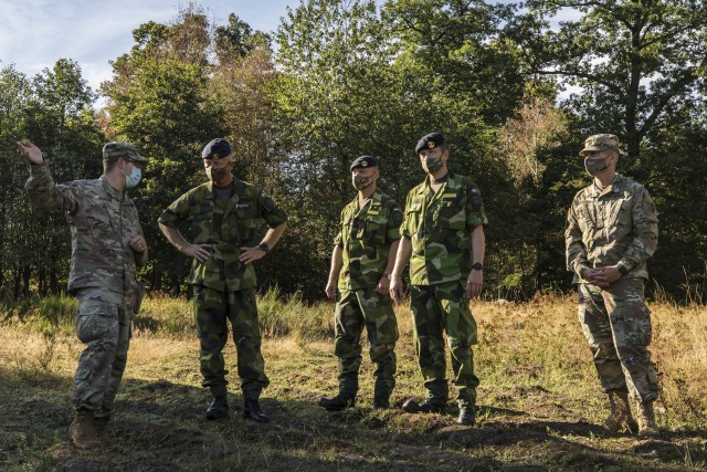 Swedish soldiers, assigned to the Air Defence Regiment, visit U.S. Soldiers assigned to the 5th Battalion, 7th Air Defense Artillery Regiment, 10th Army Air and Missile Defense Command, in Baumholder training Area, Germany on Aug. 18-20. The...