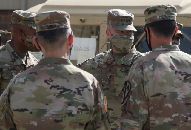 The Commanding General of the Army Materiel Command (AMC), Gen. Edward M. Daly conversates with Soldiers in the 1st Cavalry Division Sustainment Brigade’s Operation Pegasus Harvest motor pool at Fort Hood, TX, July 30. The operation targets equipment readiness by reducing excess and costs. (U.S. Army photo by Pvt. Brayton Daniel)