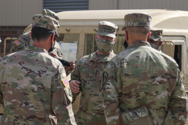 The Commanding General of the Army Materiel Command (AMC), Gen. Edward M. Daly conversates with Col. Patrick A. Disney, commander, 1st Cav. Div. Sust. Bde., and Capt. Miguel J. Denis, lead officer for the 1st Cavalry Division Sustainment Brigade’s Operation Pegasus Harvest, Fort Hood, TX, July 30. (U.S. Army photo by Pvt. Brayton Daniel)