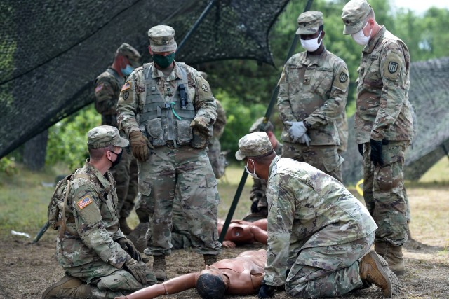 An Army Reserve observer coach/trainer assigned to the 85th U.S. Army Reserve Support Command, observes training on Performing First Aid to Open the Airway for Soldiers from the 623rd Inland Cargo Transfer Company, during Operation Ready Warrior exercise, at Fort McCoy, Wisconsin, August 22, 2020. ORW, led by the 78th Training Division, was the Army Reserve’s first collective small-scale training exercise since the start of COVID-19. The exercise was made up of partnerships from various units and organizations from the active and reserve component to include key support from the Fort McCoy Army installation that focused on COVID-19 mitigation efforts to bring Soldiers in safely to train.
(U.S. Army Reserve photo by Master Sgt. Anthony L. Taylor)