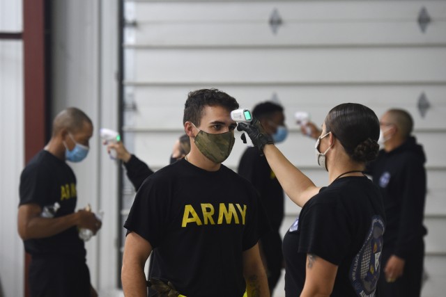Observer coach/trainers, under First Army’s 181st Multi-functional Training Brigade, conduct temperature checks on arriving Soldiers before an Army Combat Fitness Test familiarization at Operation Ready Warrior exercise, at Fort McCoy,...