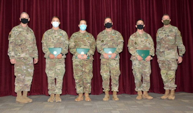 Maj. Gen. Dennis LeMaster, Spc. Tristan Chandler, Staff Sgt. Ryan Morgan, Sgt. 1st Class Jeremy Shepler, Drill Sgt. Travis Webster, and Command Sgt. Maj. Clark Charpentier at the Trinity Competition awards ceremony.
...