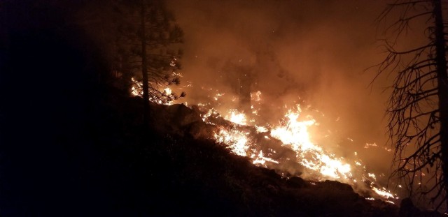 Wildland fires burn during a mid-August night near Susanville, Calif. A series of wildland fires has destroyed more than 30,000 acres of land around Susanville.