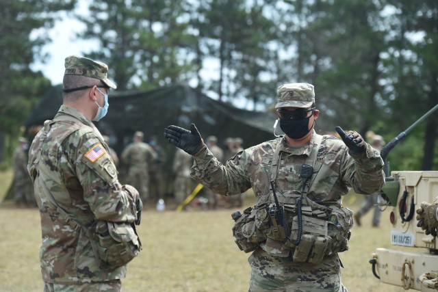 Brig. Gen. Ernest Litynski, left, commanding general of the 85th U.S. Army Reserve Support Command, meets with Chief Warrant Officer 3 Richard Begonia, an active component observer coach/trainer, assigned to 1st Battalion, 351st Regiment (Brigade Support Battalion), during Operation Ready Warrior exercise, at Fort McCoy, Wisconsin, August 22, 2020. ORW, led by the 78th Training Division, was the Army Reserve’s first collective small-scale training exercise since the start of COVID-19. The exercise was made up of partnerships from various units and organizations from the active and reserve component to include key support from the Fort McCoy Army installation that focused on COVID-19 mitigation efforts to bring Soldiers in safely to train.
(U.S. Army Reserve photo by Master Sgt. Anthony L. Taylor)