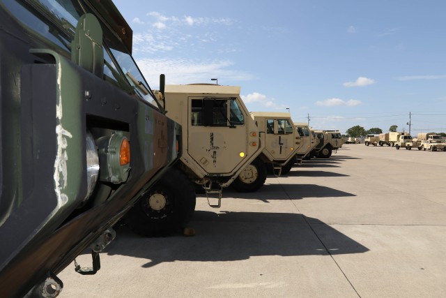 As part of Operation Pegasus Harvest, a line of M978A4 fuel servicing trucks wait for departure in a motor pool July 30 on Fort Hood, TX. The operation focuses on reducing excess equipment and vehicles to minimize costs. (U.S. Army photo by Pvt. Brayton Daniel)