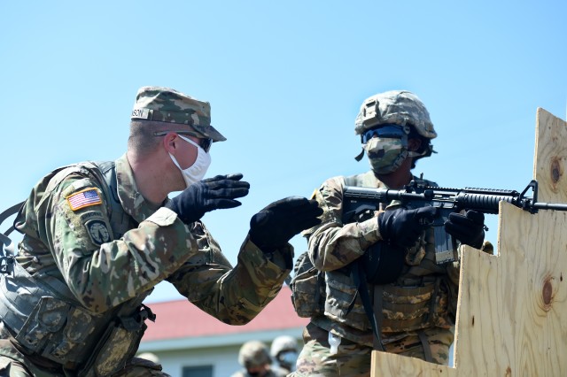 U.S. Army Reserve Sgt. 1st Class Eric Monson, left, observer coach/trainer assigned to the 1st Battalion, 383rd Regiment in Des Moines, Iowa, instructs a Soldier assigned to the 849th Quartermaster Company, Rocky Mount, North Carolina, during Table 3 of the new Army Individual Weapons Qualification standards that will take effect on October 1, 2020. The preliminary marksmanship instruction was part of Operation Ready Warrior exercise, at Fort McCoy, Wisconsin. ORW, led by the 78th Training Division, was the Army Reserve’s first collective small-scale training exercise since the start of COVID-19. The exercise was made up of partnerships from various units and organizations from the active and reserve component to include key support from the Fort McCoy Army installation that focused on COVID-19 mitigation efforts to bring Soldiers in safely to train.
(U.S. Army Reserve photo by Master Sgt. Anthony L. Taylor)