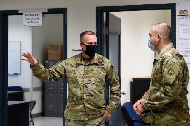 Brig. Gen. Walter Duzzny, left, commanding general of the 78th Training Division, meets with Brig. Gen. Ernest Litynski, commanding general of the 85th U.S. Army Reserve Support Command, during Operation Ready Warrior exercise, at Fort McCoy,...