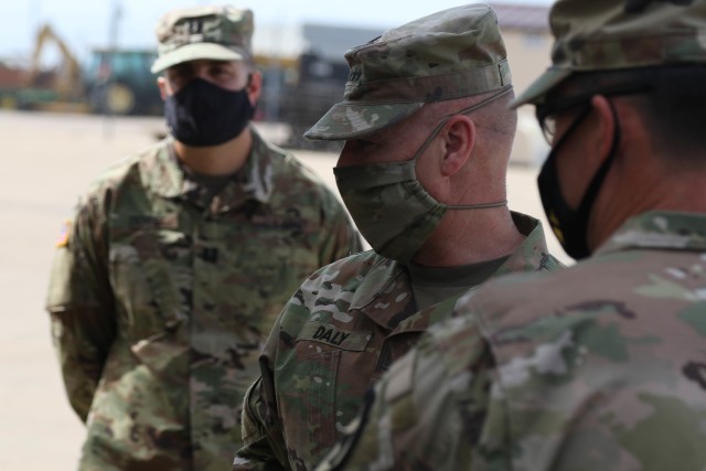 Capt. Miguel J. Denis, lead officer for the 1st Cavalry Division Sustainment Brigade’s Operation Pegasus Harvest, stands by while Gen. Edward M. Daly, commander, Army Materiel Command and Col. Patrick A. Disney, commander, 1st Cav. Div. Sust. Bde., begin their walk through of the operation’s motor pool on Fort Hood, TX, July 30. Denis says the operation consolidates the division’s excess equipment to improve readiness and prepare the First Team for modernization. (U.S. Army photo by Pvt. Brayton Daniel)