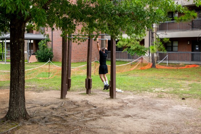 A Soldier at the Fort Benning Recovery Center performs pull-ups while quarantined. 
...