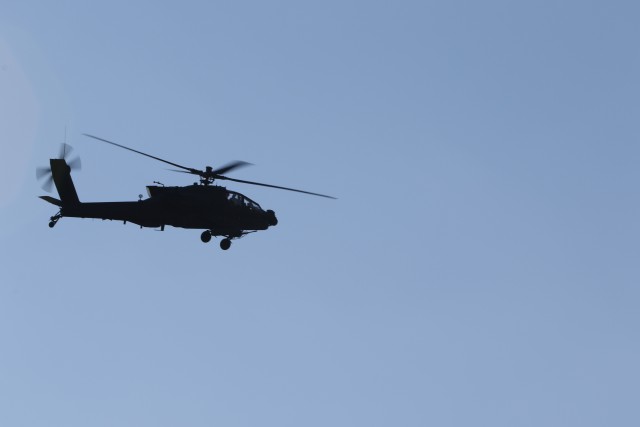 During an aerial gunnery range exercise, a U.S. Army AH-64D Apache Longbow moves down range during an aerial gunnery range exercise at Fort Bragg, North Carolina, Jan. 28, 2020.  The exercise allows pilots to perform qualifications on the Apache’s weapons system and maintain mission readiness. (U.S. Army photo by Pfc. Joshua Cowden, 22nd Mobile Public Affairs Detachment)
