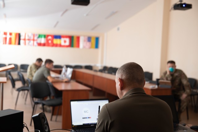 Multinational partners participate in a video call during the final planning conference for Rapid Trident 2020 on Aug. 12 at Combat Training Center-Yavoriv, Ukraine. (Photo by Cpl. Shaylin Quaid, JMTG-U Public Affairs)