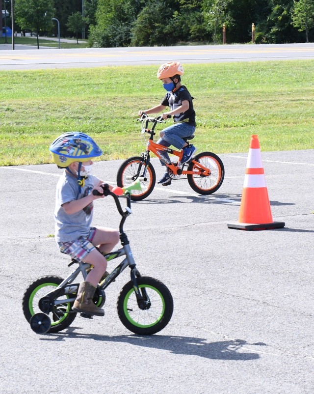 Fort Drum children practiced bicycle safety while having fun Aug. 26 during a Bike Rodeo at the Magrath Sports Complex parking lot. The event was hosted by Fort Drum Family and Morale, Welfare and Recreation, with the American Red Cross as event sponsor. (Photo by Mike Strasser, Fort Drum Garrison Public Affairs)