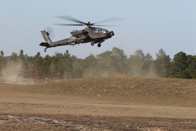 During an aerial gunnery range exercise, a U.S. Army AH-64D Apache Longbow approaches the range qualification course during an aerial gunnery range exercise at Fort Bragg, North Carolina, Jan. 28, 2020. The more than 1,100-acre range had over 460 targets controlled by a team in the observation tower.  (U.S. Army photo by Pfc. Joshua Cowden, 22nd Mobile Public Affairs Detachment)