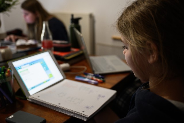 Kendal Morgenweck, a 5th-grade student at Hohenfels Elementary School, does her daily online assignments from home at Hohenfels Training Area.