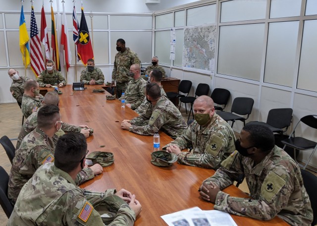 The Task Force Illini force protection team conducts an after action review after a force protection exercise at Combat Training Center-Yavoriv, Ukraine Aug. 21. (Photo by Cpl. Shaylin Quaid, JMTG-U Public Affairs)