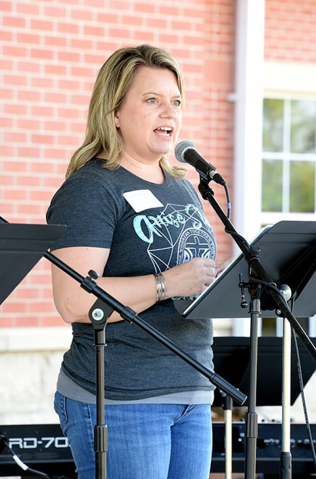 Protestant Women of the Chapel President Jodi Billquist delivers a diamond-themed message and shares the verse Isaiah 60:1 during the PWOC drive-in fall kickoff Aug. 25 in front of Frontier Chapel. PWOC members listened to the kick-off event on...