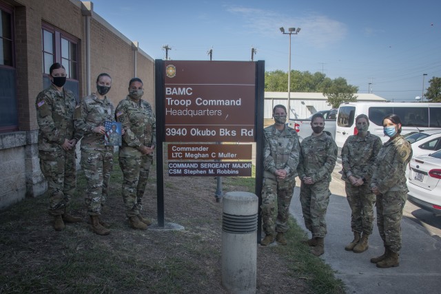 Brooke Army Medical Center Troop Command leaders; Capt. Arie Emde, Capt. Audrey Mosley, Capt. Veronica Waites-Moore, Lt. Col. Meghan Muller, Capt. Tamara Johnson-Caswell, 1st Sgt. Carrie Hurst and 1st Sgt. Melinda Griffin pose for a photo outside Troop Command Headquarters, Fort Sam Houston, Texas, Aug. 27, 2020. For the first time, the battalion and all five companies are commanded by women. (U.S. Army photo by Jason W. Edwards)