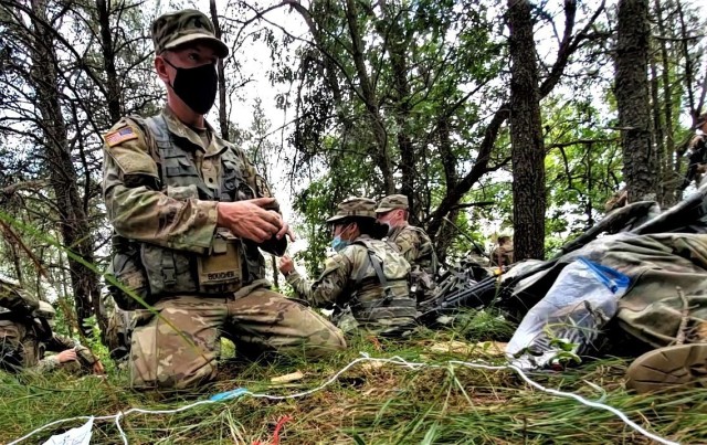 ROTC Cadet Mason Boucher with the University of Wisconsin-Stevens Point ROTC program and other cadets participate in field training Aug. 13, 2020, at Fort McCoy, Wis. Dozens of ROTC cadets from seven universities trained at Fort McCoy for 10 days...