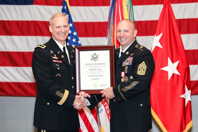 Lt. Gen. Scott D. Berrier, U.S. Army deputy chief of staff, G-2, presents Command Sgt. Maj. Dennis A. Eger, U.S. Army DCS G-2 sergeant major, with a certificate of retirement during Eger’s retirement ceremony at the U.S. Army Intelligence and Security Command, Fort Belvoir, Virginia, Aug. 21, 2020. Eger honorably served the U.S. Army and the nation for 32 years.