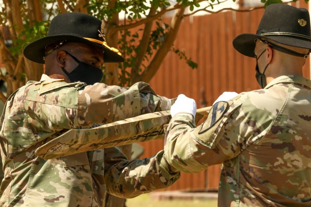 The 154th Composite Truck Company Commander, Capt. Anthony Alteri and company First Sergeant, 1st Sgt. Antwain Stokes, case the unit’s guidon during a ceremony at the 1st Cavalry Division museum on Fort Hood, Texas, August 18, 2020. The company...