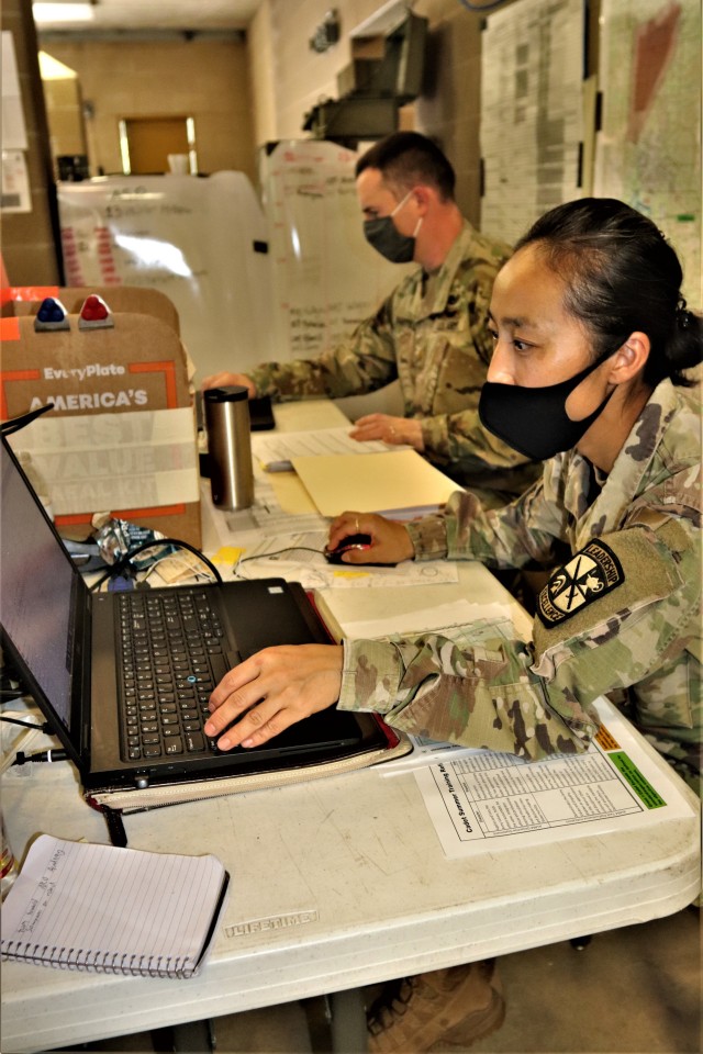 Maj. Dan Bartlett and Capt. Hyeon Kim, both who served as operations officers with ROTC training at Fort McCoy in early August 2020, plan some training Aug. 13, 2020, in a building at the Combined Arms Collective Training Facility on South Post at...