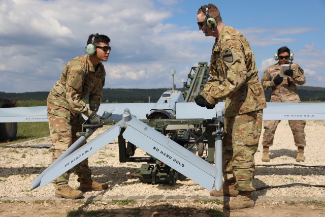052620-A-FG635-5103    Pfc. Eduardo Dominguez, Spc. Andres Tamez and Spc. Alec James, all with the 2nd Armored Brigade Combat Team, 1st Cavalry Division, Deception  Co., 8th Brigade Engineer Battalion from Fort Hood, Texas work on and ensure the...