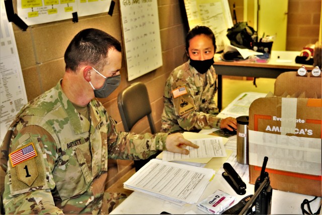 Maj. Dan Bartlett and Capt. Hyeon Kim, both who served as operations officers with ROTC training at Fort McCoy in early August 2020, plan some training Aug. 13, 2020, in a building at the Combined Arms Collective Training Facility on South Post at...