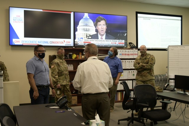 Fort Hunter Liggett provided an installation tour after the community relations meeting with Congressmen Jimmy Panetta and Salud Carbajal, military and civilian leaders in the Monterey area, August 19, 2020.  Director of Plans, Training, Mobilization and Security Bill Riley provides an overbrief of the garrison Emergency Operations Center to Congressman Carbajal. He emphasized the partnership and inclusion of local government in garrison emergency planning and exercises.