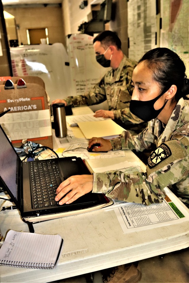 Maj. Dan Bartlett and Capt. Hyeon Kim, both who served as operations officers with ROTC training at Fort McCoy in early August 2020, plan some training Aug. 13, 2020, in a building at the Combined Arms Collective Training Facility on South Post at...