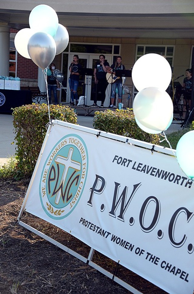 Worship leaders sing in front of Frontier Chapel as the Protestant Women of the Chapel drive-in fall kickoff begins Aug. 25. PWOC members listened to the kick-off event on the radio from their cars. The event was also broadcast live on Facebook....