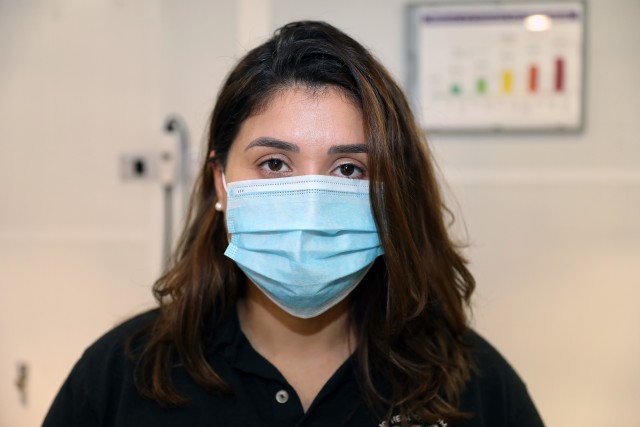 Dr. Angeli Mohanani-Posey, an Army Hearing Program Coordinator with Public Health Command Europe, poses for a picture while wearing a face mask.