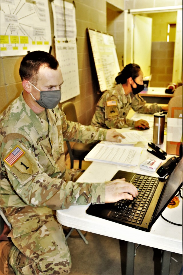 Maj. Dan Bartlett and Capt. Hyeon Kim, both who served as operations officers with ROTC training at Fort McCoy in early August 2020, plan some training Aug. 13, 2020, in a building at the Combined Arms Collective Training Facility on South Post at...
