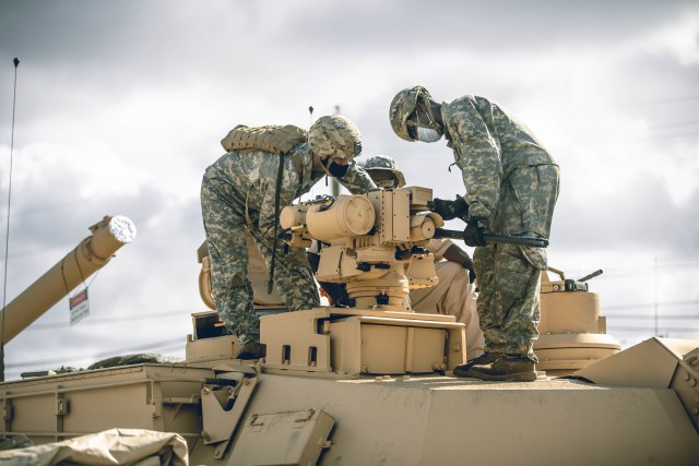 Troopers assigned to Bravo Company, 3rd Battalion, 8th Cavalry Regiment, 3rd Armored Brigade Combat Team (3ABCT), 1st Cavalry Division, conduct preventative maintenance checks and services on their new M1A2C (SEP v.3) Abrams Tanks at Fort Hood, Texas, July 21, 2020. The modernization of the Greywolf brigade, with the addition of being the first unit in the Army to receive the new Abrams tanks, makes 3ABCT the most lethal and agile armored brigade in the Army. (U.S. Army photo by Sgt. Calab Franklin)