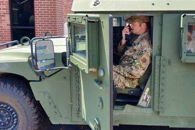 Airmen with the Louisiana National Guard&#39;s 122nd Air Support Operation Squadron conduct radio checks prior to leaving Camp Beauregard, Pineville, Louisiana, Aug. 24, 2020. 122nd ASOS teams provide enhanced radio and satellite communications...