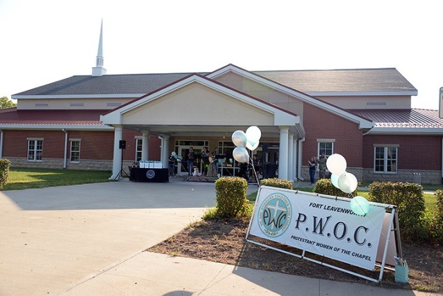 Worship leaders sing in front of Frontier Chapel as the Protestant Women of the Chapel drive-in fall kickoff begins Aug. 25. PWOC members listened to the kick-off event on the radio from their cars. The event was also broadcast live on Facebook....