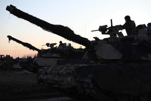 1st Battalion, 8th Cavalry Regiment, 2nd Armored Brigade Combat Team, 1st Cavalry Division’s, M1A2 Abrams tanks take up strategic positions during their live fire exercise in preparation for Combined Resolve XIII in Grafenwohr, Germany, Jan. 16,...