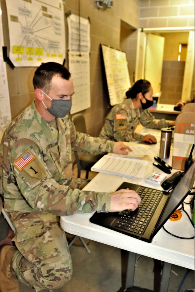 Maj. Dan Bartlett and Capt. Hyeon Kim, both who served as operations officers with ROTC training at Fort McCoy in early August 2020, plan some training Aug. 13, 2020, in a building at the Combined Arms Collective Training Facility on South Post at...