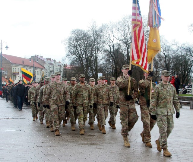 Soldiers with the 1st Battalion, 9th Cavalry Regiment, 2nd Armored Brigade Combat Team, 1st Cavalry Division, participating in the formal flag raising ceremony for the three Baltic States, and the Independence Day Parade, commemorating the...