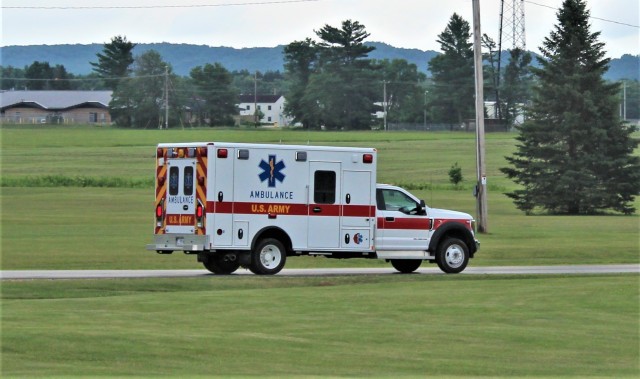 An ambulance and crew with the Directorate of Emergency Services Fire Department moves on the cantonment area July 9, 2020, after an emergency response at Fort McCoy, Wis. Fort McCoy fire and ambulance personnel maintain operations 24 hours a day,...