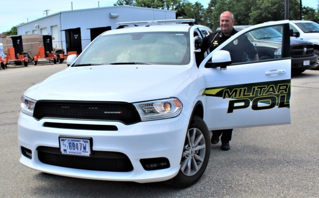 Police Sgt. Kevin Eckelberg gets into a new police cruiser June 25, 2020, assigned to the Fort McCoy Directorate of Emergency Services Police Department at Fort McCoy, Wis. The department received this first Dodge Durango-based cruiser for use...